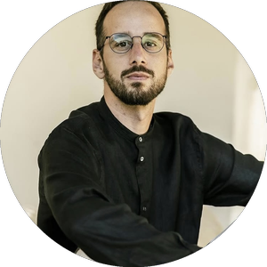 waist-up-portrait-handsome-serious-unshaven-male-keeps-hands-together-dressed-dark-blue-shirt-has-talk-with-interlocutor-stands-against-white-wall-sel